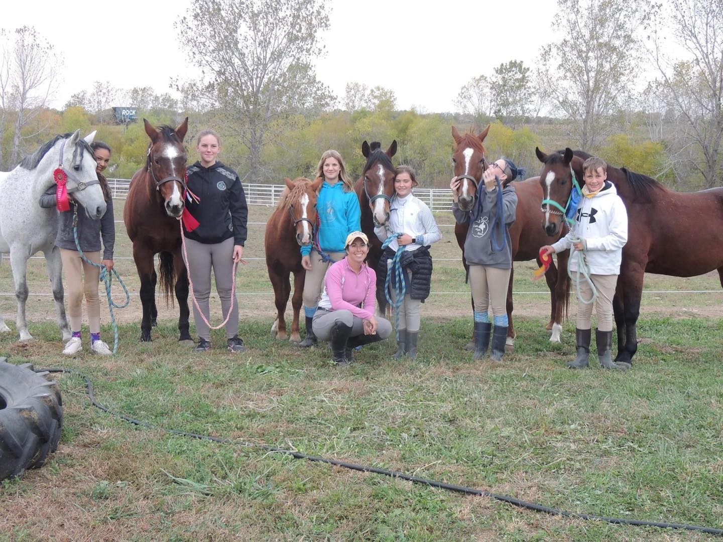 Students, horses and trainer at the end of a dressage and combined test show in Kansas City.